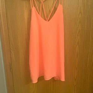Hot pink tank top with criss cross straps